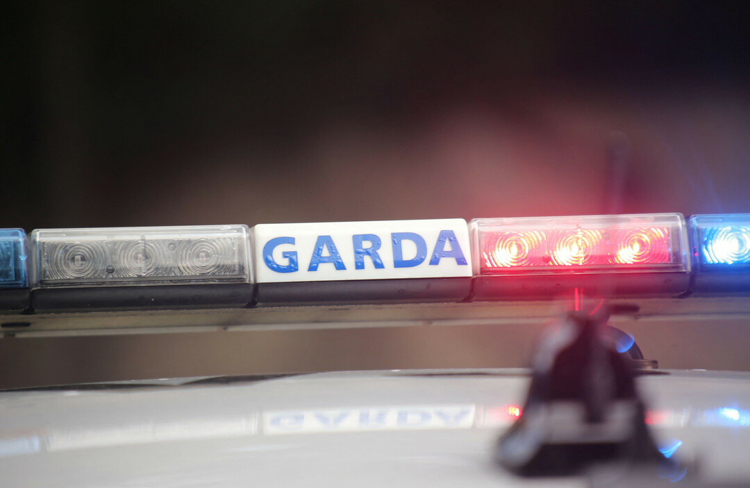 Close-up of a police light bar with “GARDA” lettering and red, blue, and white LEDs.