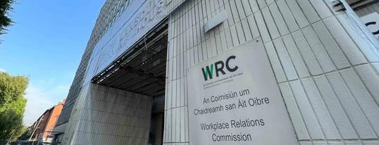 Exterior of a large building with a WRC sign and Irish workplace relations commission logo.